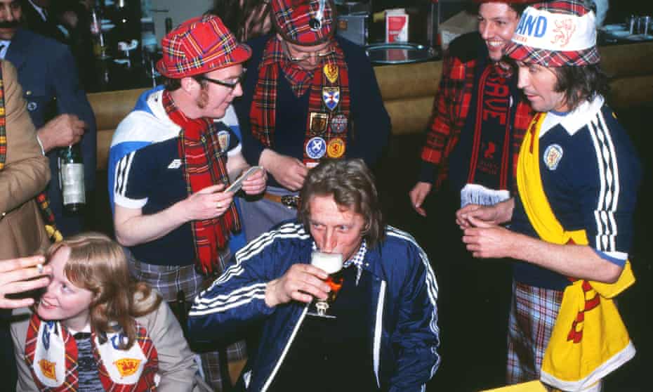 Denis Law shares a beer with Scotland fans at the 1978 World Cup.