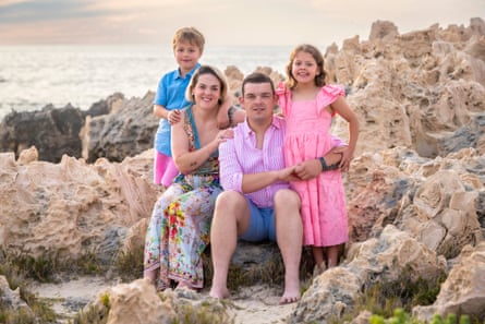 Ellie and Bryan with their family on the beach in Perth.