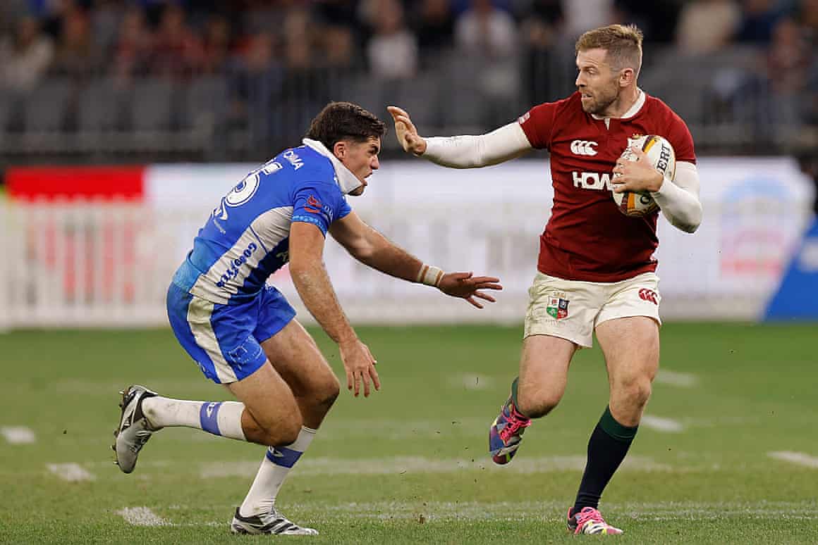 Elliot Daly fends off Ben Donaldson in Perth.