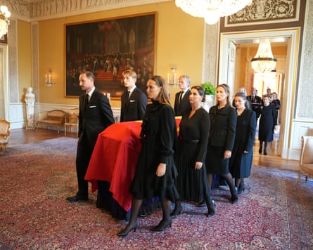 King Harald V’s coffin is carried to Oslo’s Palace Chapel by members of the royal family