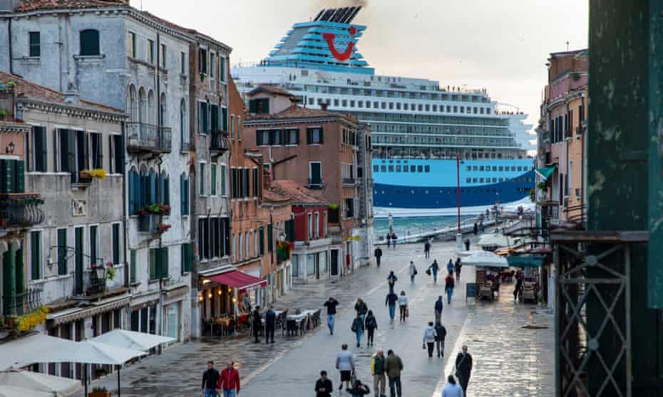 A Tui cruise ship passes along the Giudecca Canal, as seen from Via Garibaldi, Venice.