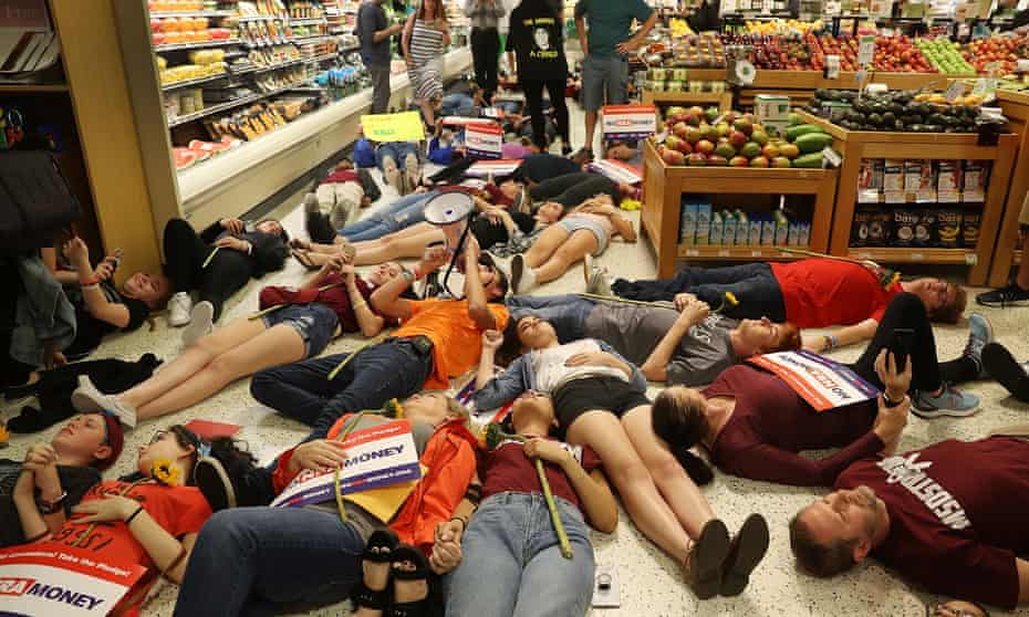 Protesters participate in a ‘die-in’ at a Publix supermarket in Coral Springs, Florida.