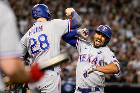 The Rangers' Marcus Semien, right, celebrates his three-run home run with Jonah Heim during the third inning.