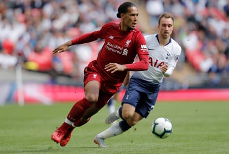 Spurs’ Christian Eriksen gives chase as Liverpool’s Virgil Van Dijk surges forward.