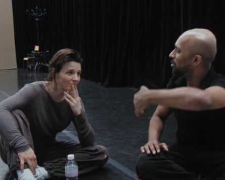 Man and woman sitting on floor talking to each other