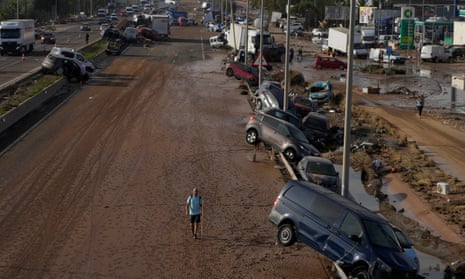 Vehicles are seen piled up after being swept away by floods on a motorway in Valencia, Spain, Thursday, Oct. 31, 2024. (AP Photo/Manu Fernandez)