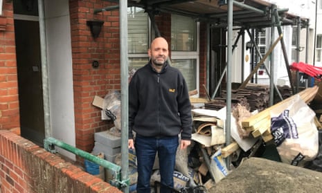 James Hobby outside his house after the roof collapse.