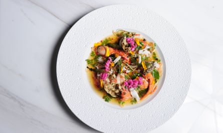 Seafood dish from Paste, Bangkok, served on a white plate and photographed from above.