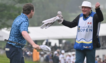 Robert MacIntyre celebrates on the 18th green at the Canadian Open alongside caddie and father Dougie MacIntyre