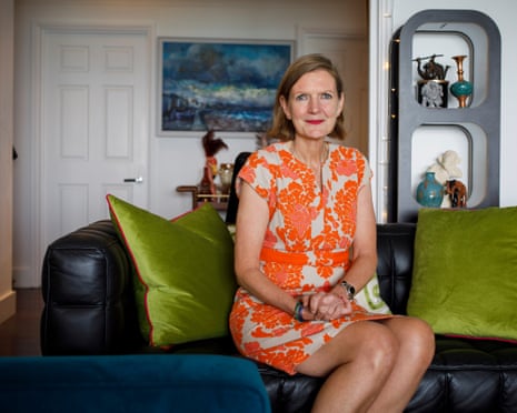 Lisa Jackson on a sofa, hands folded, at home