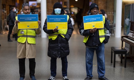 Workers at a 'welcome hub' for arriving Ukrainians at St Pancras station in London.
