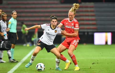 Manchester United’s new signing Lucía García tussles with Maximiliane Rall during their pre-season match against Bayern Munich.