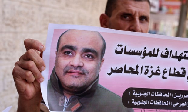 A picture of Mohammad el Halabi is held at a solidarity gathering in Gaza City on Tuesday.
