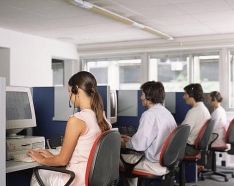 A row of call centre workers pictured from behind