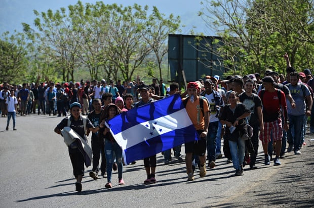 Honduran migrants heading to Puerto Barrios, in Guatemala, after breaking a police fence at the border crossing between Honduras and Guatemala, on Wednesday.