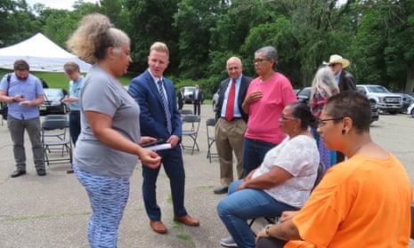 Shawn LaTourette, New Jersey's environmental protection commissioner, speaks to Angel Stefancik, a member of the Turtle Clan of the Ramapough Lenape Nation and others after a press conference in Ringwood, New Jersey on Thursday.