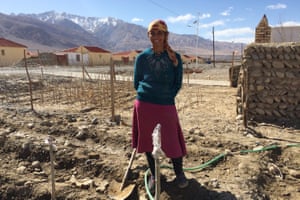 Nuyuft Arkin, a 45-year- old farmer, outside the new home on the outskirts of Tashkurgan.