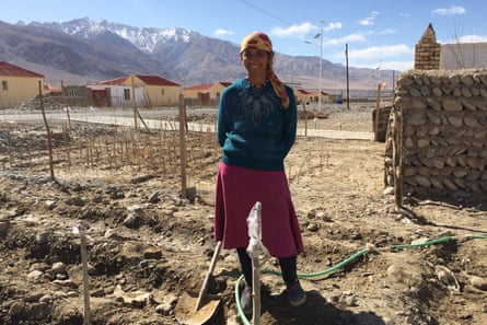 Nuyuft Arkin, a 45-year- old farmer, outside the new home on the outskirts of Tashkurgan.