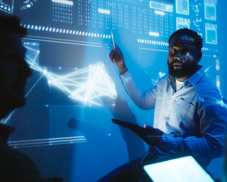 Software engineering team reviewing code