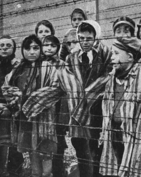 Auschwitz-Birkenau: Child survivors standing behind barbed wire after liberation
Still photograph from a Soviet Army film, taken by Alexander Vorontsov, a cameraman in the film unit of the First Ukrainian Front, a few days after the liberation of the camp. Wiener Holocaust Library Collections.