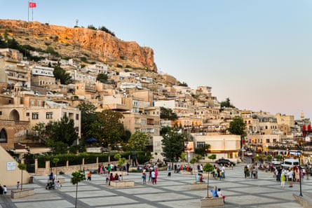 Houses on a hillside, with a square below