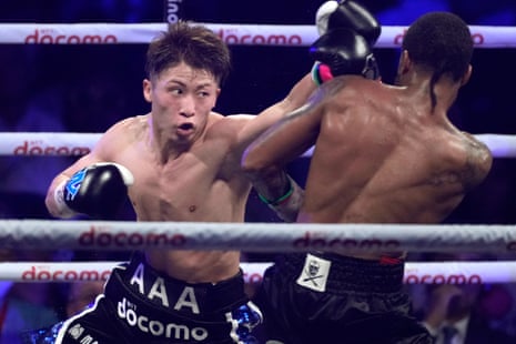 Naoya Inoue, left, throws a punch against Stephen Fulton during their world title fight.
