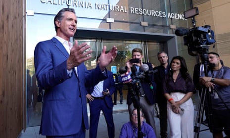 California governor Gavin Newsom speaks to reporters. The state has filed a lawsuit against some of the world's largest oil and gas companies.