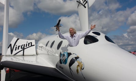 Lofty ambitions: Richard Branson holds a model of LauncherOne in 2012 at the Farnborough Air Show.