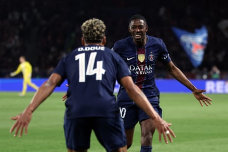 PSG’s Ousmane Dembele celebrates with Desire Doue after scoring their team fifth goal.