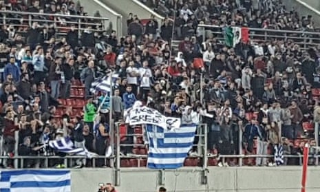 Greek fans pictured holding the offensive banner during Sunday’s World Cup qualifier.