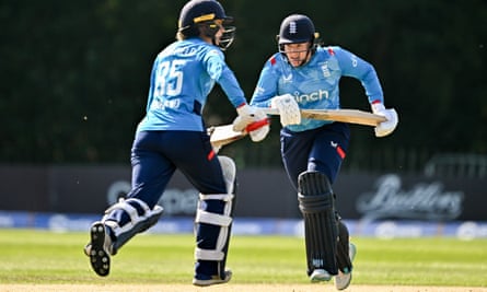 Debutants Hollie Armitage, right, and Paige Scholfield scamper between the wickets.