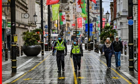 Police patrol the central shopping areas of Cardiff, Wales