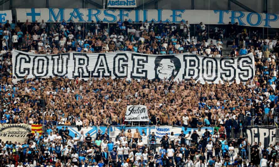 Marseille fans show their support for former club president Tapie in a Europa League match against Galatasaray last week.