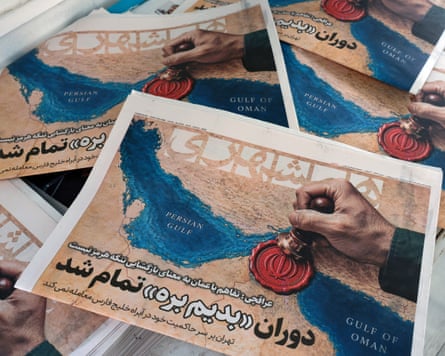 Copies of thee Hamshahri newspaper featuring a picture of the strait of Hormuz and a headline: ‘The Oman deal doesn’t mean the reopening of the Strait of Hormuz’
