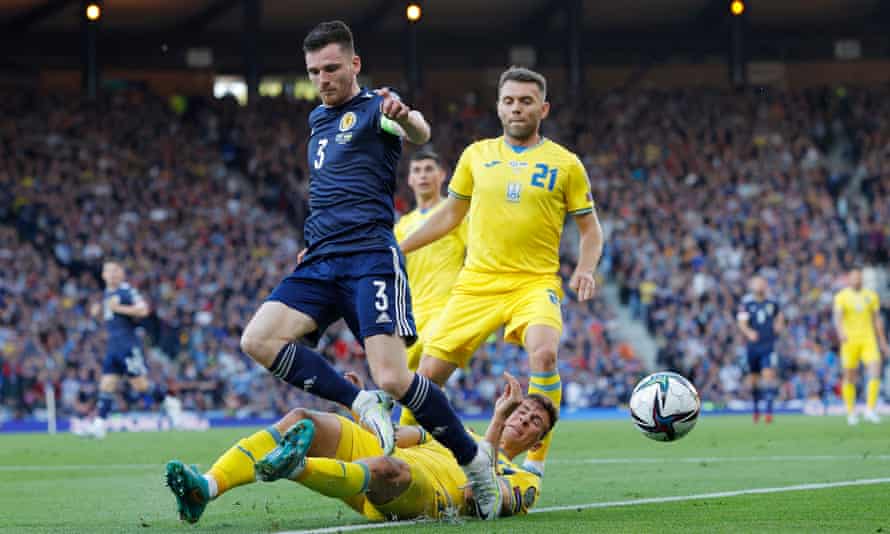 Scotland’s Andy Robertson is denied by Ukraine’s Illia Zabarnyi as Oleksandr Karavayev looks on.