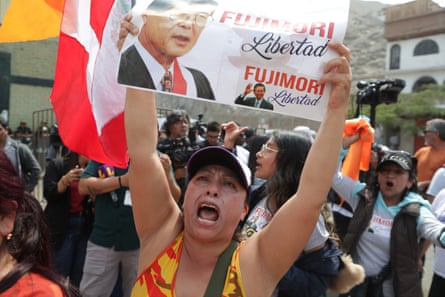 Supporters of former president Alberto Fujimori await outside of Penal Barbadillo for his release on Wednesday in Lima, Peru.