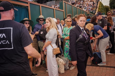 Visitors to the Wimbledon wait to enter one of the courts