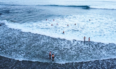people swimming in cold sea