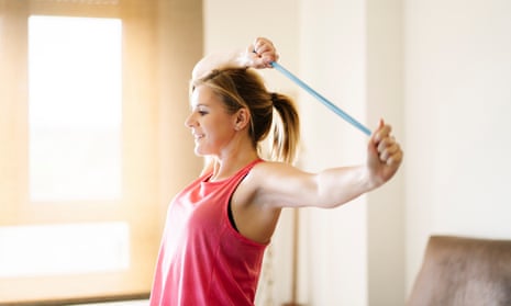 ‘To loosen up tense shoulders, grab a resistance band or an old pair of tights, and practise shoulder flossing.’