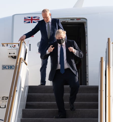 Lord Gerry Grimstone (top) arrives at Abu Dhabi airport with Boris Johnson in March during their visit to the UAE and Saudi Arabia.