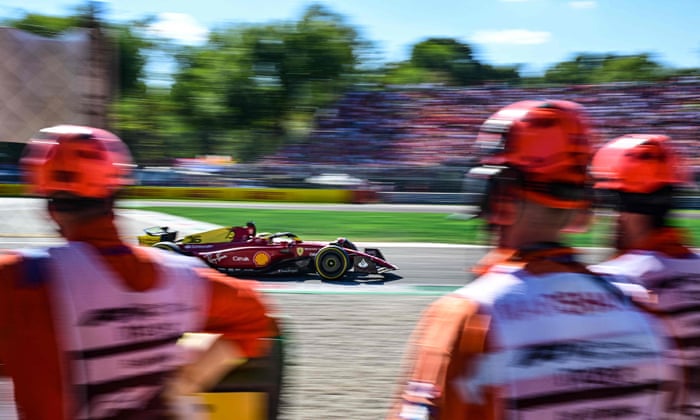 Verstappen leads at Italian Grand Prix: F1 – live! | Formula One 2 Track marshalls watch as Ferrari's Charles Leclerc steers his car.