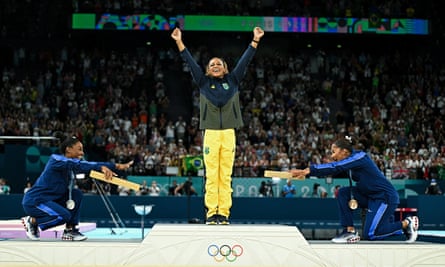 Jordan Chiles and Simone Biles helped create a striking image when they bowed to Rebeca Andrade on the medal podium