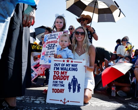 Zoe Bonter and her children, Luka, 18-months, and Mila, five, wait for the arrival of the USS Abraham Lincoln, San Diego, California, 8 October 2026.