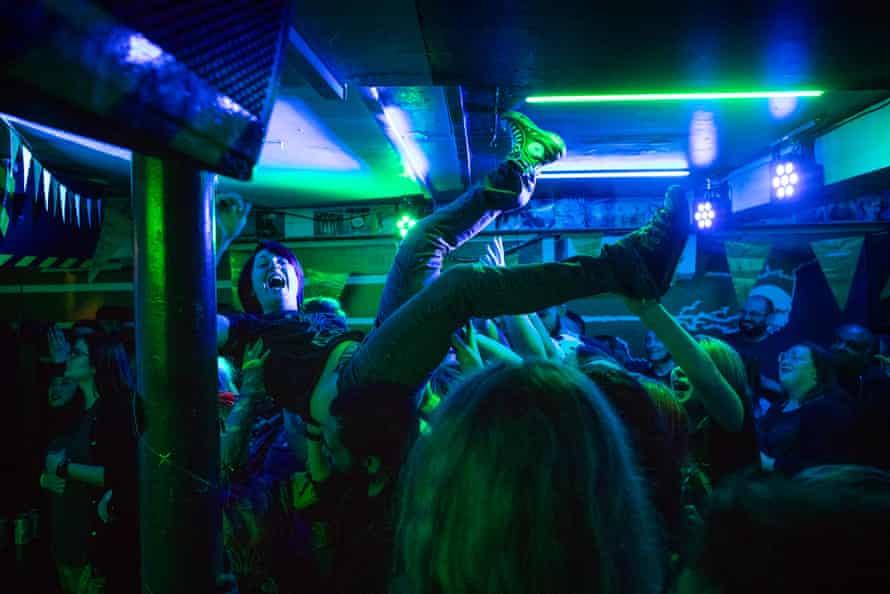 Dancing on the ceiling ... A crowd surfer during Nova Twins.