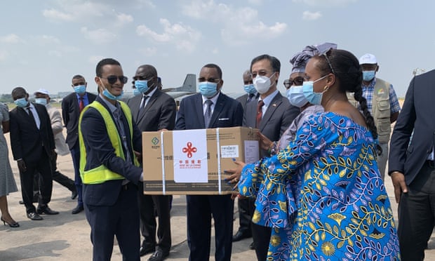 Congolese officials with the Chinese ambassador to the Republic of Congo, Ma Fulin, receive the country’s first batch of Covid-19 vaccines in Brazzaville, 10 March 2021.