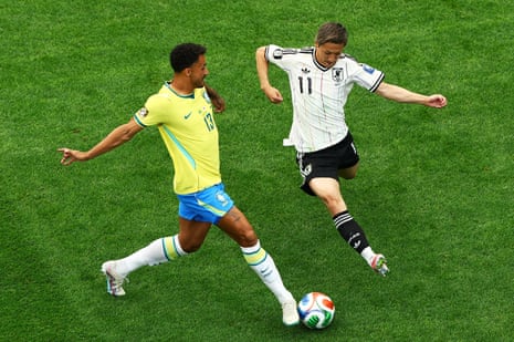 Brazil's Danilo in action with Japan's Daizen Maeda.