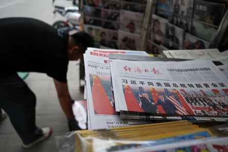 Newspapers with images of Xi Jinping meeting Donald Trump at the Great Hall of the People.