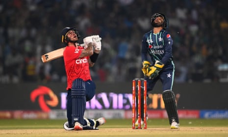 Alex Hales of England attempts a sweep shot and is dismissed.