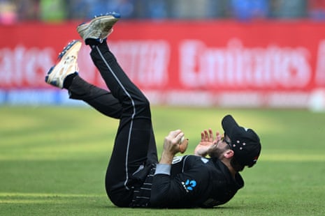 Kane Williamson tumbles over after taking the catch.