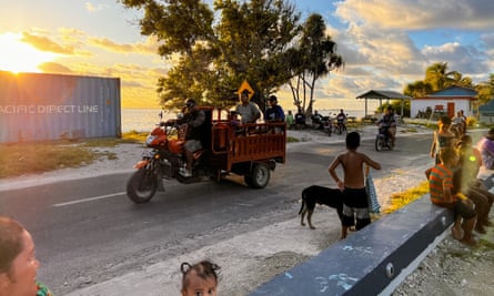 Locals make their way home as the sun sets in Tuvalu